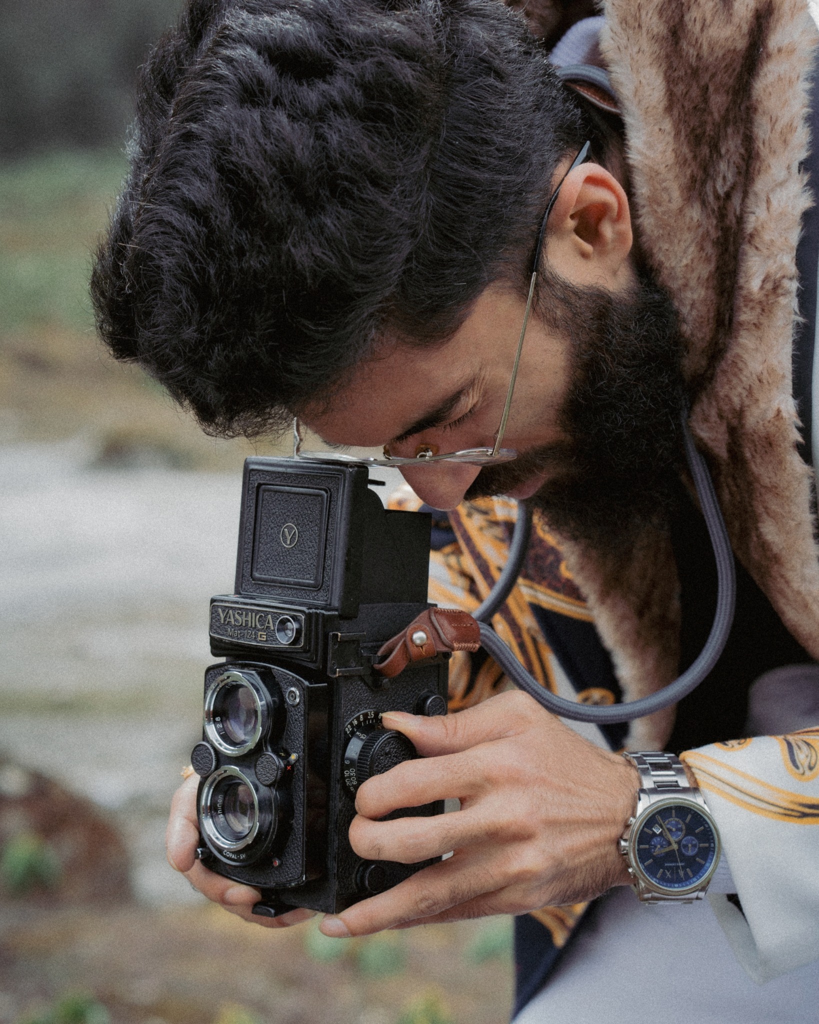 Sourish Mukherjee composing a photograph with a Yashica Mat 124G